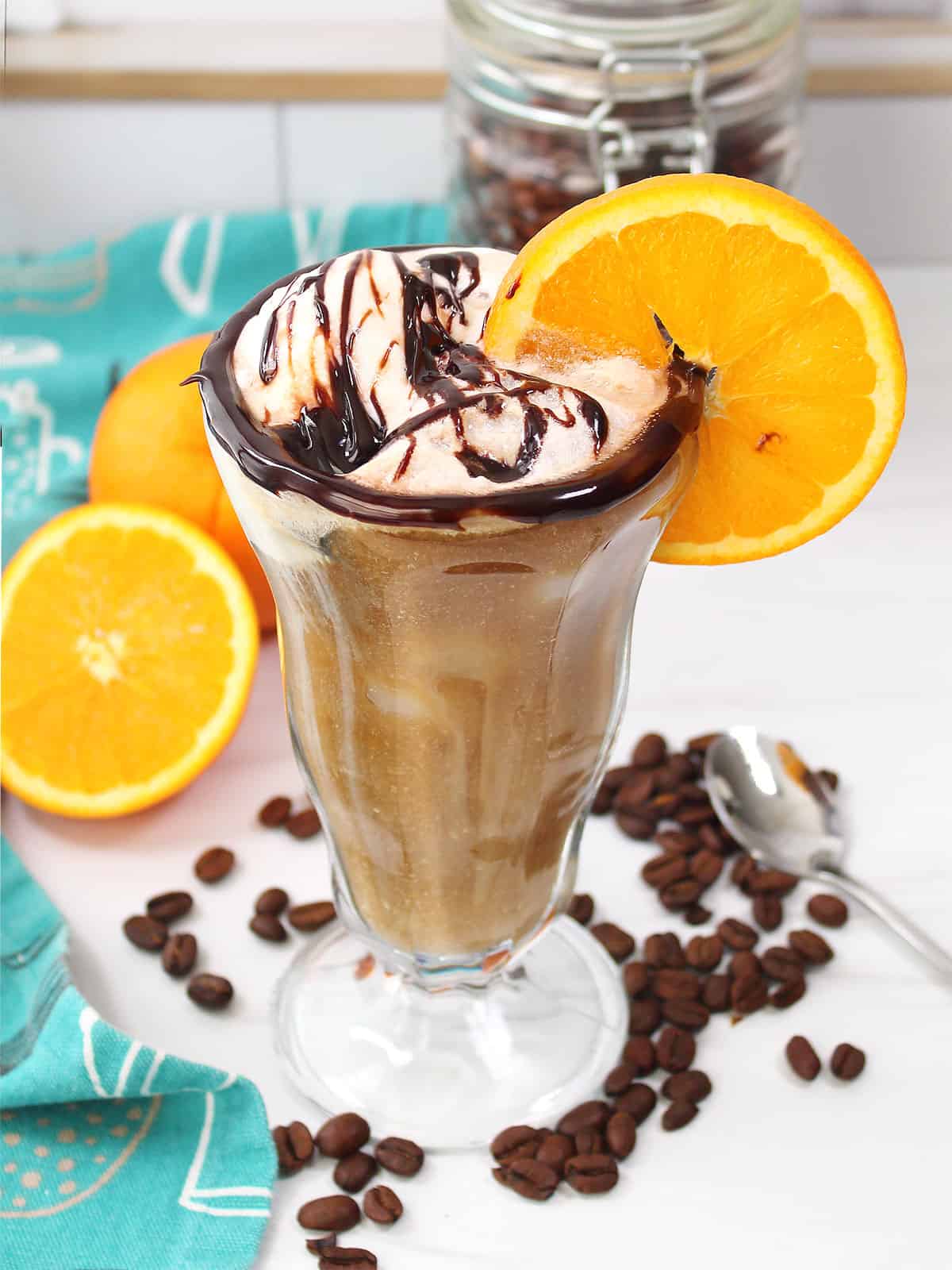 Cold Brew Coffee Float with orange peel and chocolate drizzle.