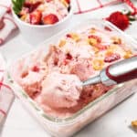 Scooping frozen ice cream.
