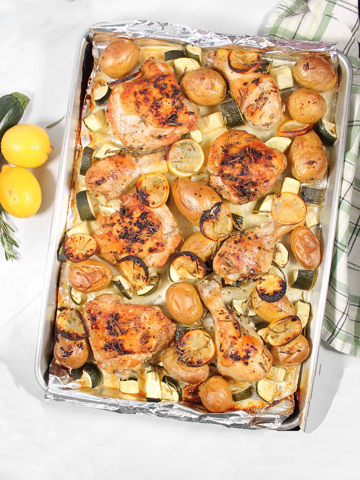 Baked sheet pan lemon chicken on sheet pan.