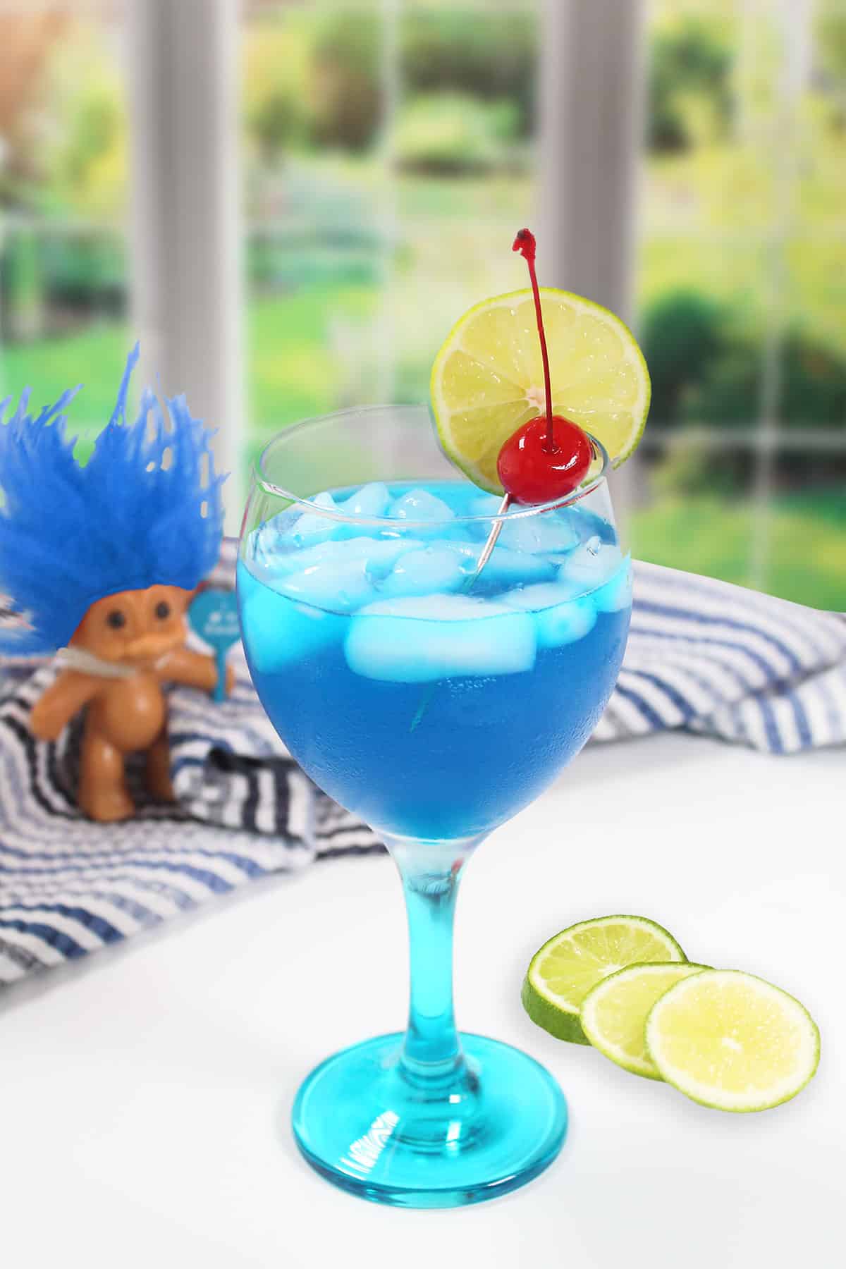Papa Smurf cocktail by window.
