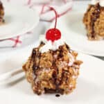 Closeup of fried ice cream with a cherry on top.