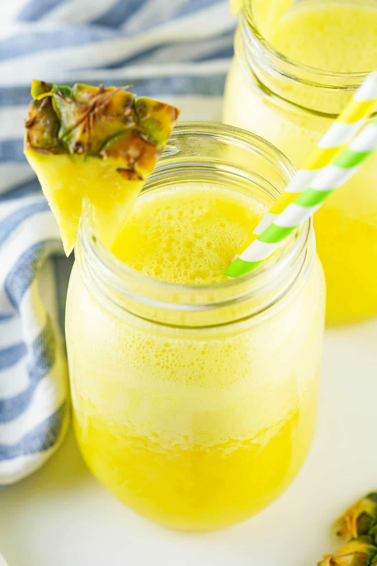 Looking into Agua Fresca with pineapple in mason jar.