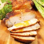Air fried frozen pork chops in air fryer sliced with gravy.