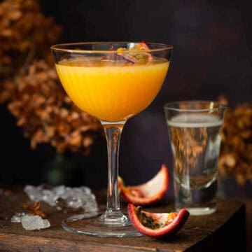 Passionfruit martini with dark background.