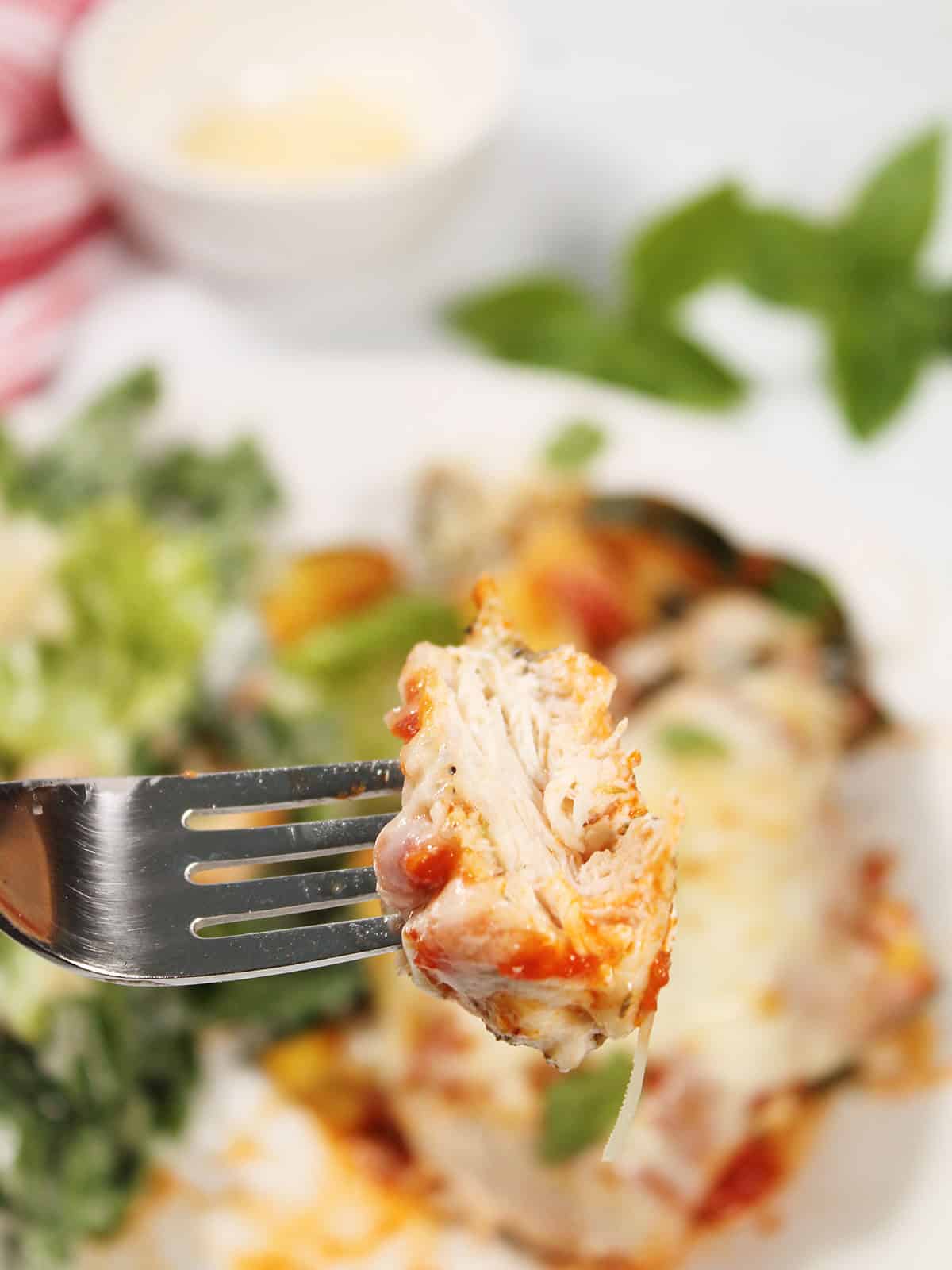 Bite of air fryer chicken on fork.