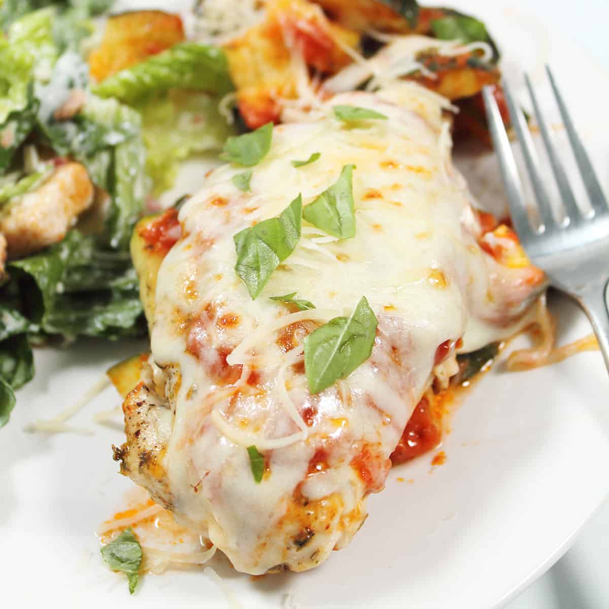 Air Fryer Italian Chicken Foil Packets plated with basil garnish.