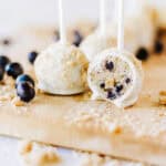 Blueberry muffin cake pops with one halved to show center.