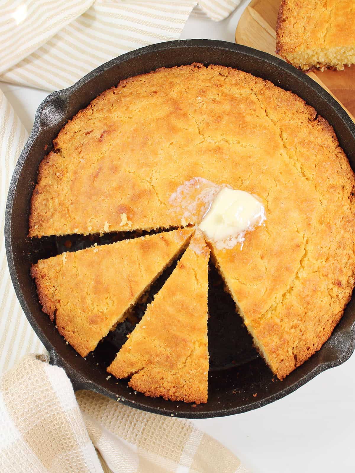 Sliced Buttermilk Skillet cornbread in cast iron skillet.