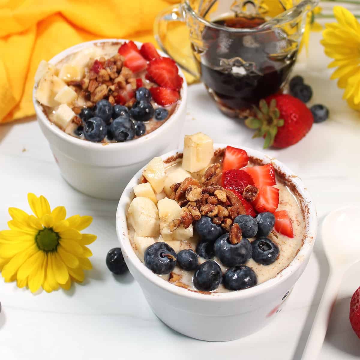 Two servings of French Toast overnight oats topped with fruit.