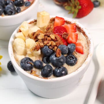 Single serving of overnight oats with fruit and nuts on top.