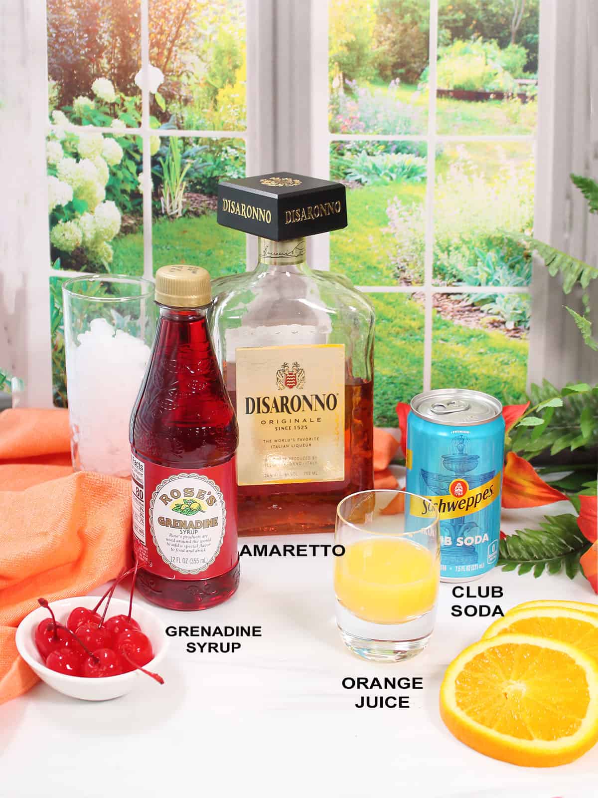 Ingredients for an amaretto sunset cocktail.