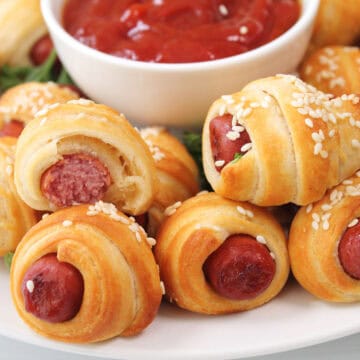 Closeup of pigs in blanket straight out of the air fryer.