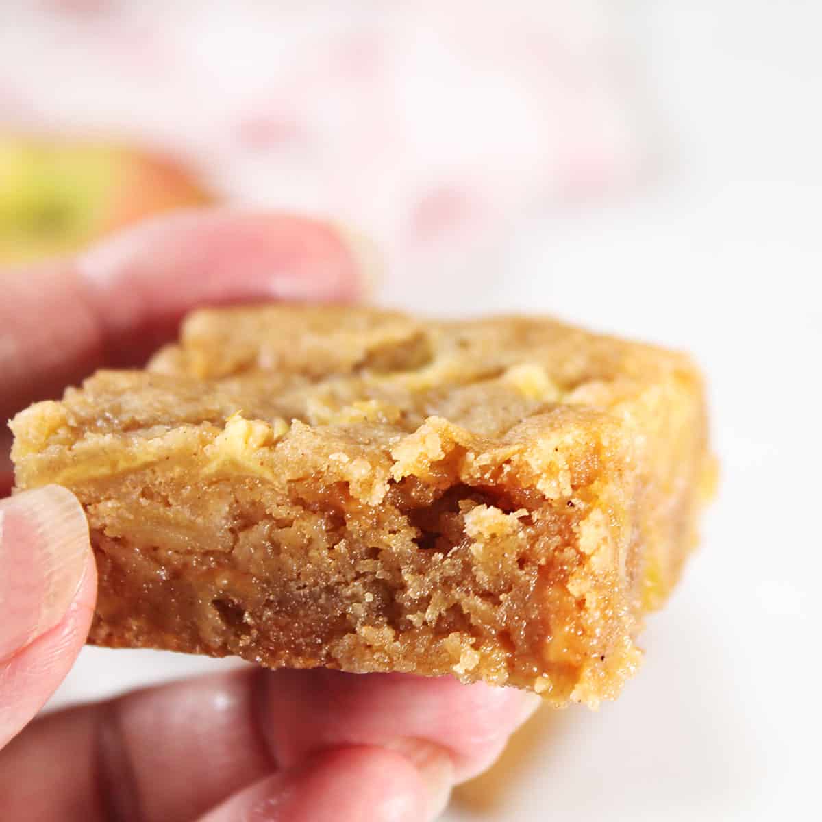 Holding an apple blondie.