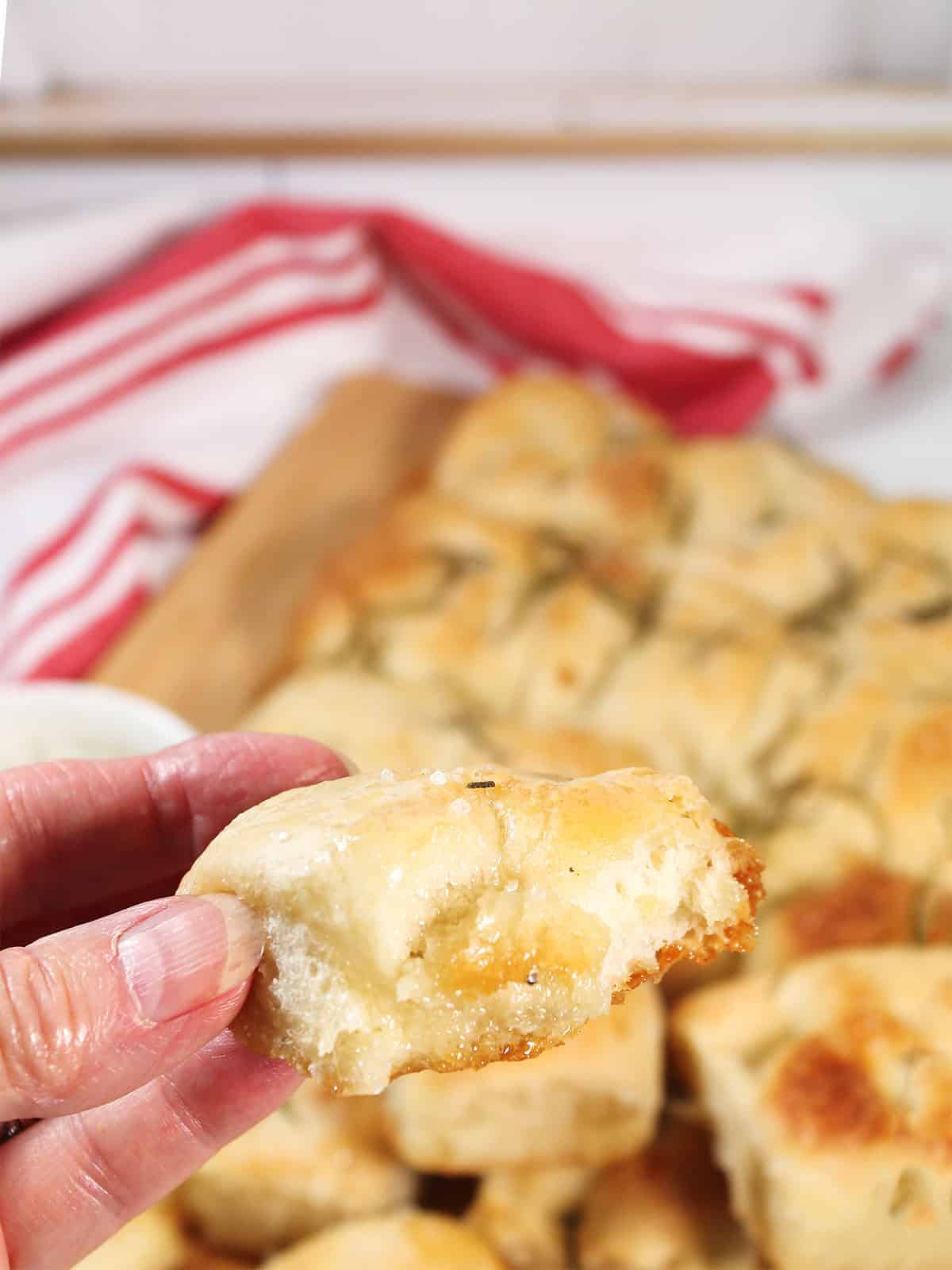 Holding a piece of easy focaccia.
