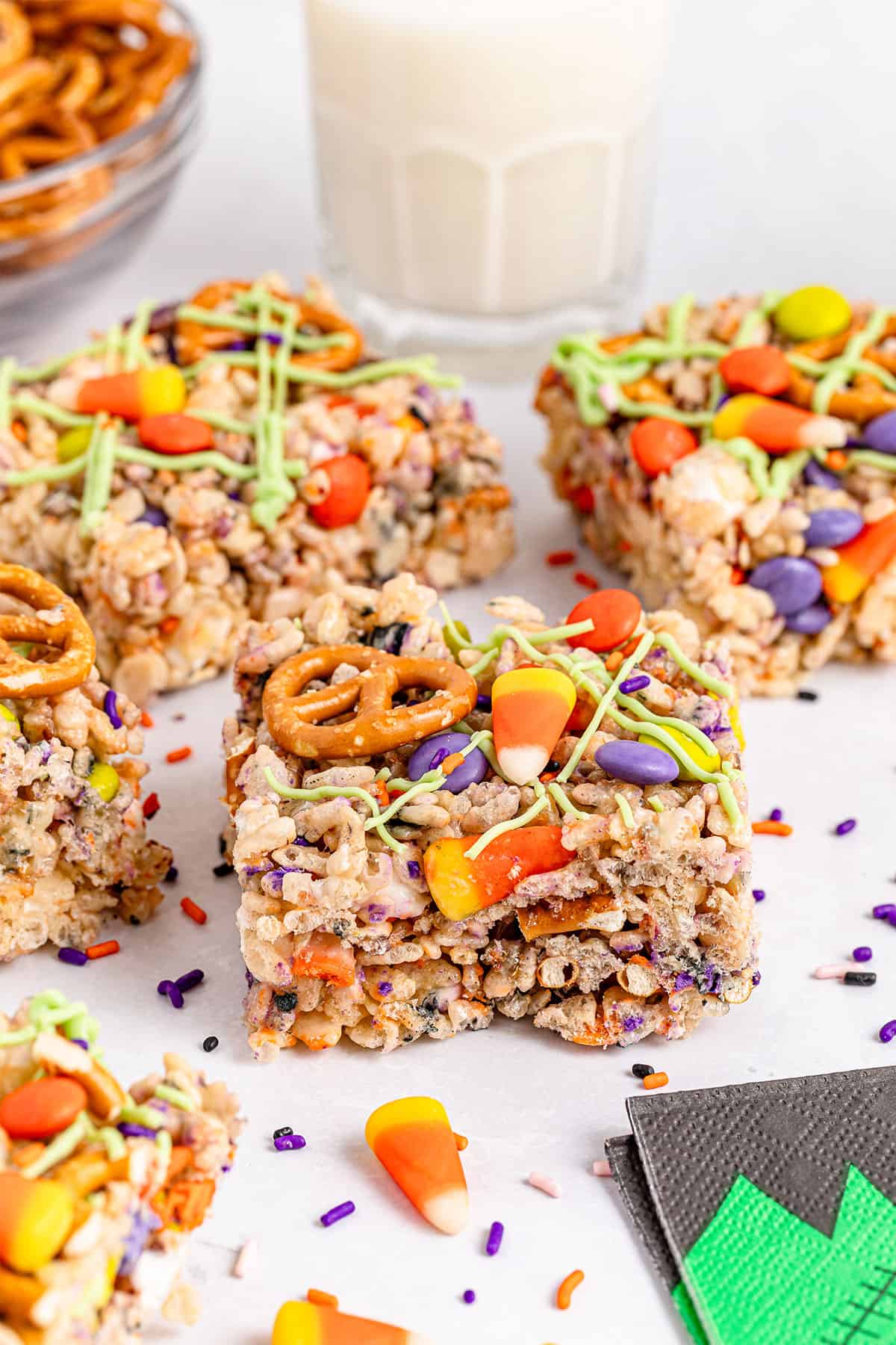 Halloween Rice Krispie Treats on table with milk.