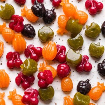 Homemade fruit snacks scattered on table.