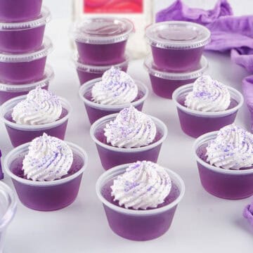 Finished purple jello shots with garnish.