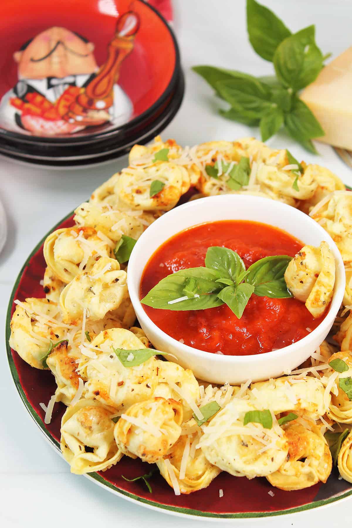 Air Fryer Tortellini on serving plate with marinara.