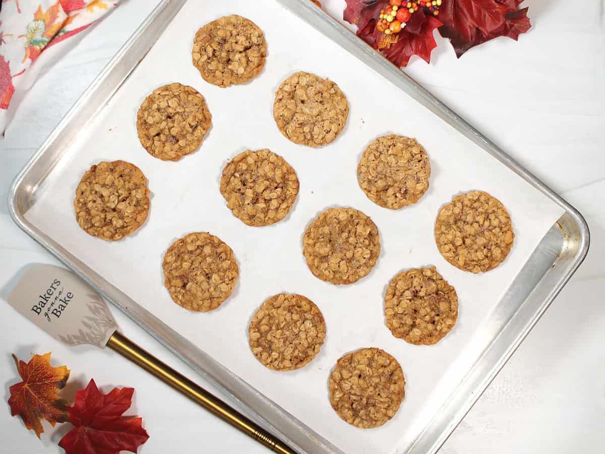 Baked oatmeal cookies on cookie sheet.