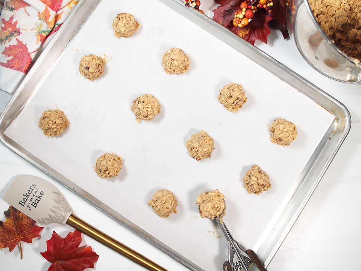 Scooping cookie dough onto cookie sheet.