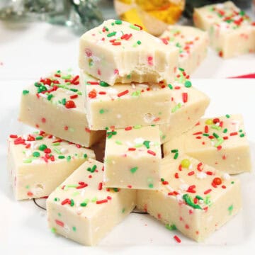 Stack of sugar cookie fudge with sprinkles.