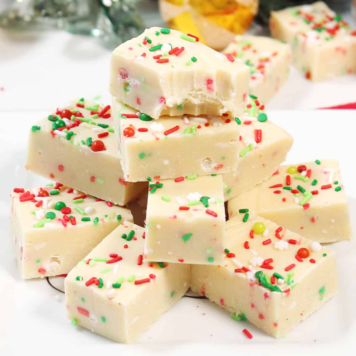 Stack of sugar cookie fudge with sprinkles.