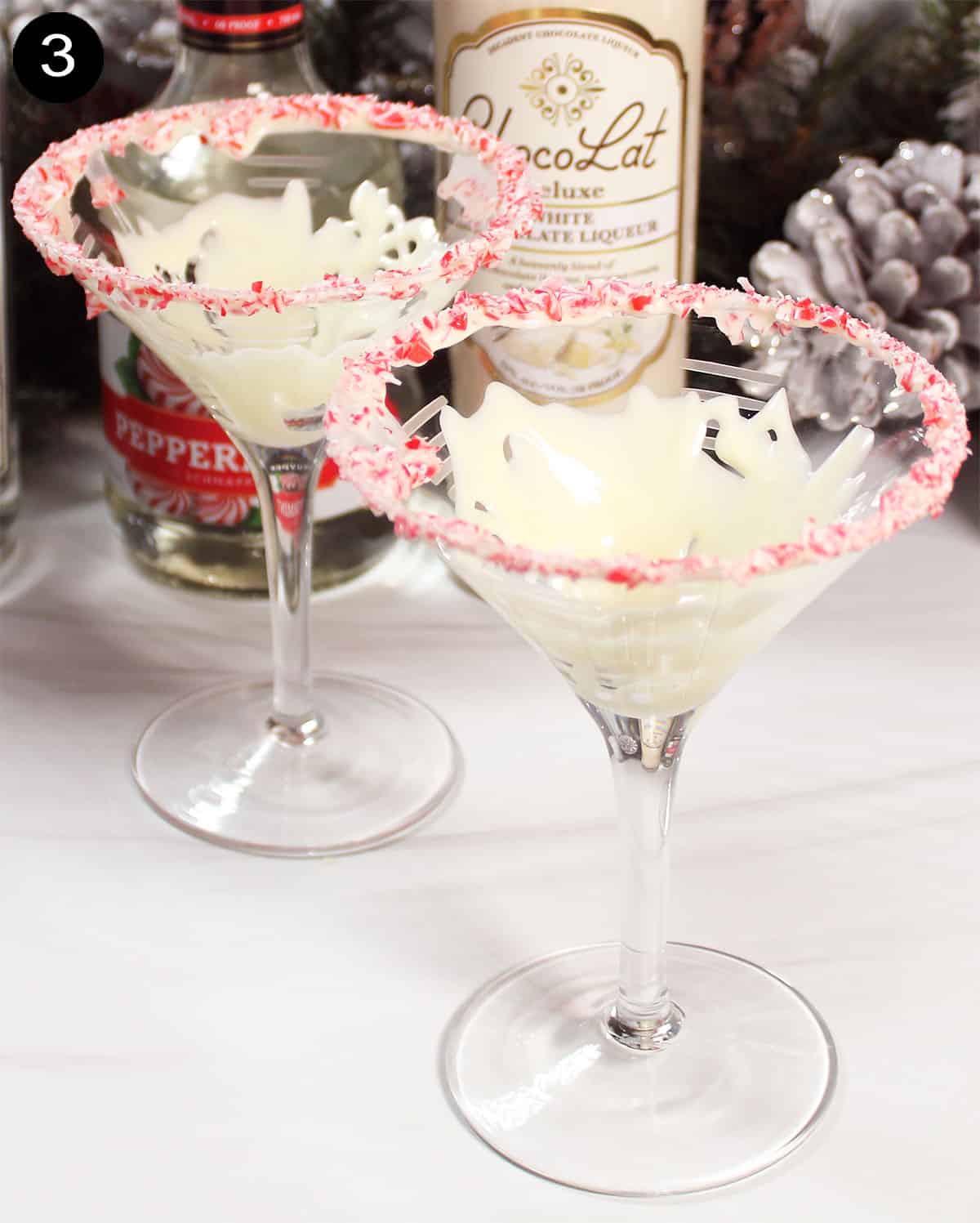 Coating inside of martini glass with white chocolate.
