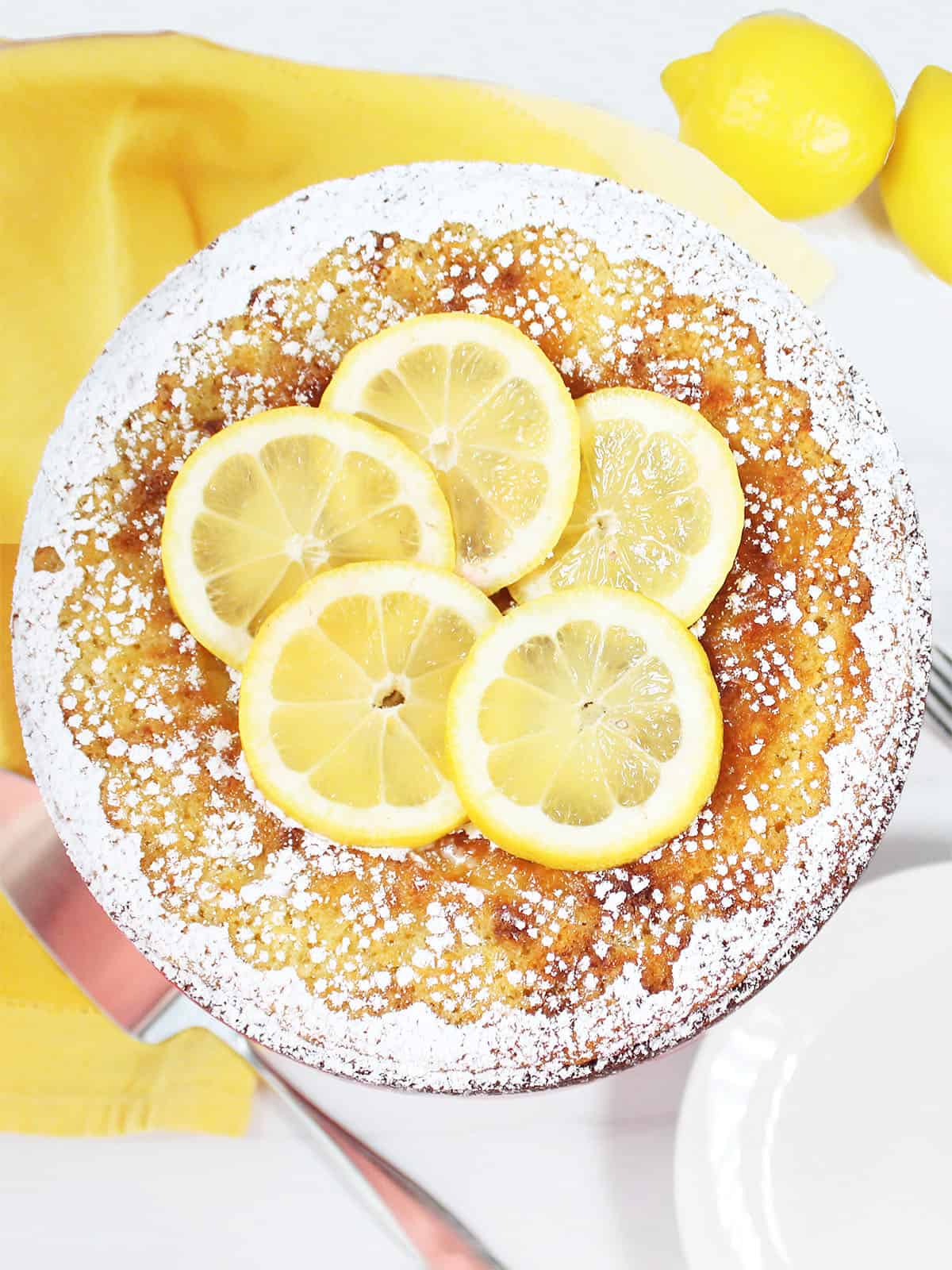 Baked Lemon Ricotta Cake with powdered sugar decoration.