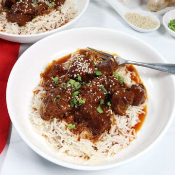 Serving of Instant Pot Korean Beef with sesame seeds and green onions.