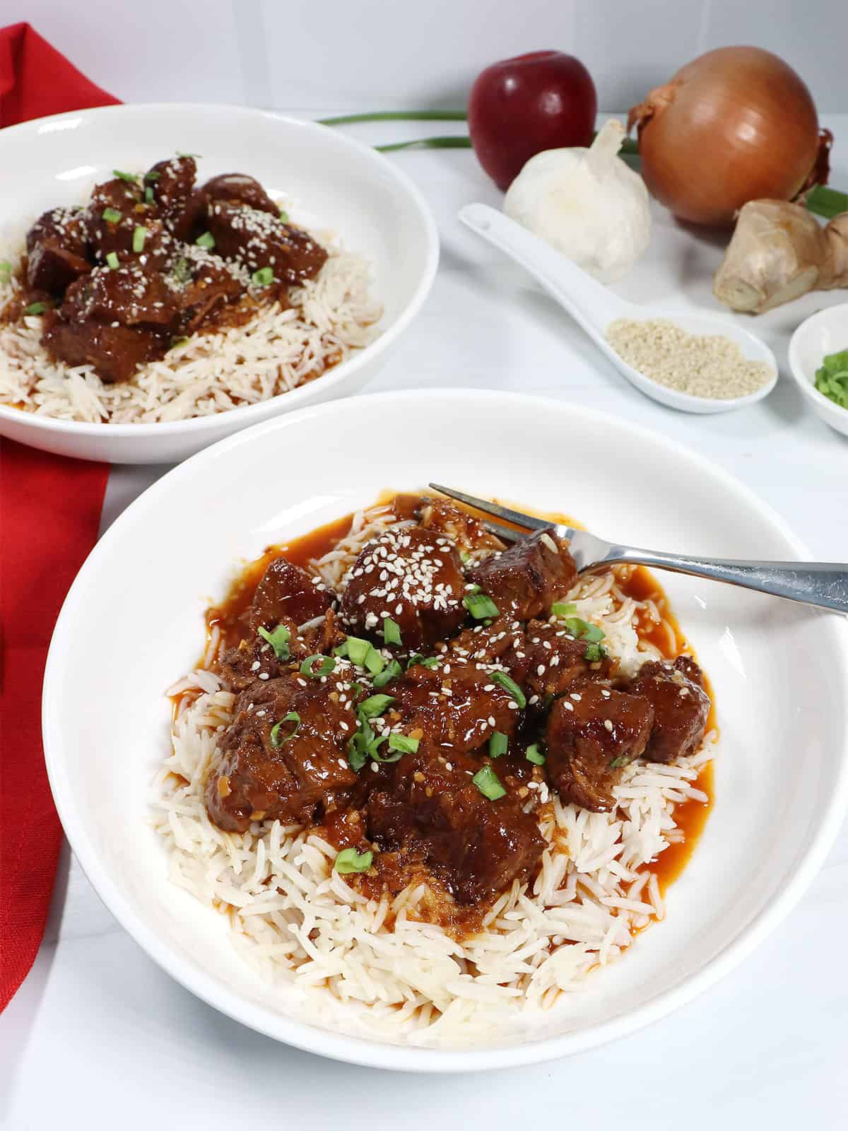Two servings of Instant Pot Korean Beef over rice.